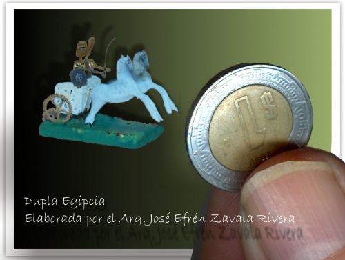 Dupla, carruaje de guerra de los egipcios, elaborado con dos ruedas de engrane de reloj. Se puede imaginar su tamaño si lo comparamos con la moneda que nos sirve de escala. - 19 Jan 2009